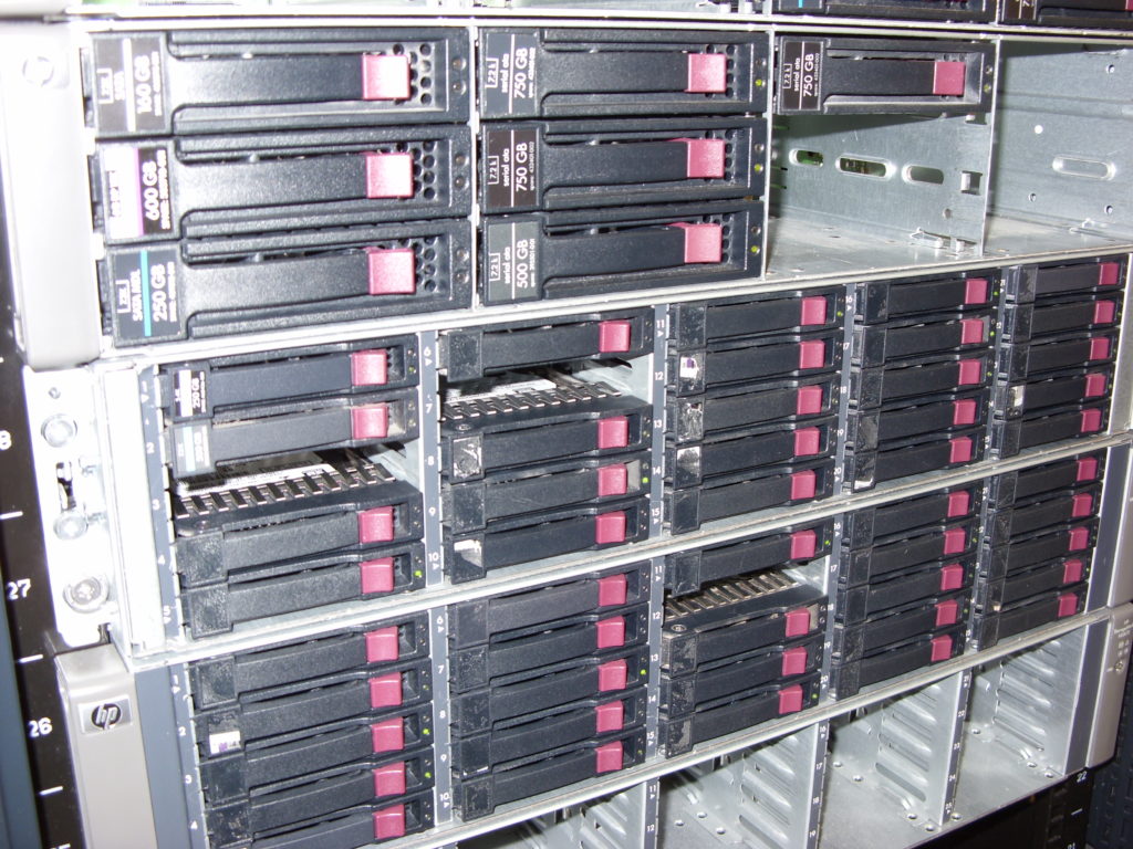 Toronto data recovery tech inspecting a hard drive Server data recovery